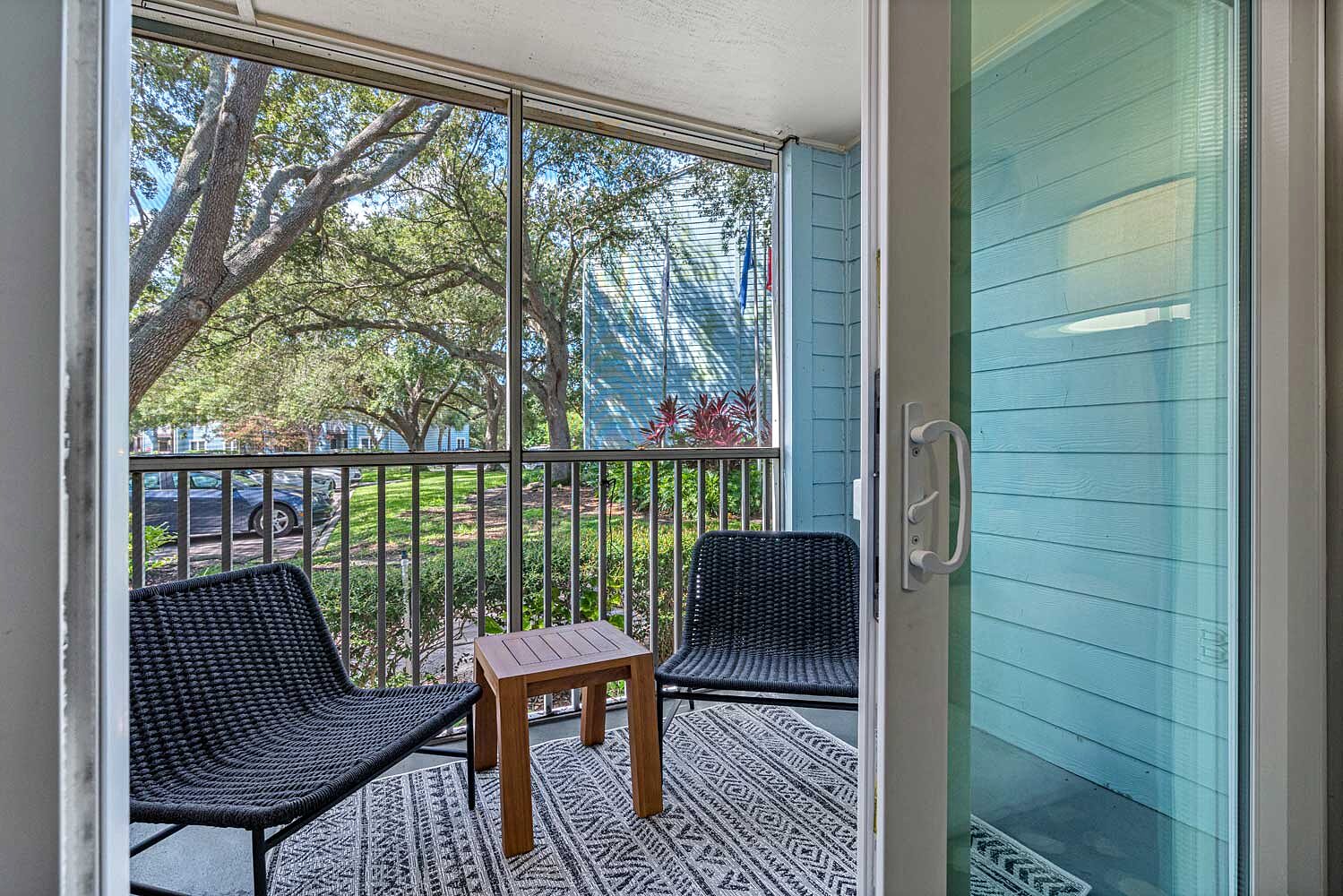 Cortland Bowery screened patio overlooking mature landscaping